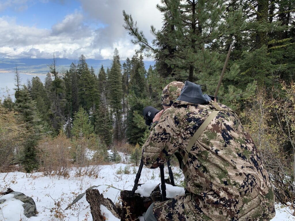 Jim Harmer glassing for animals in the mountains while hunting.